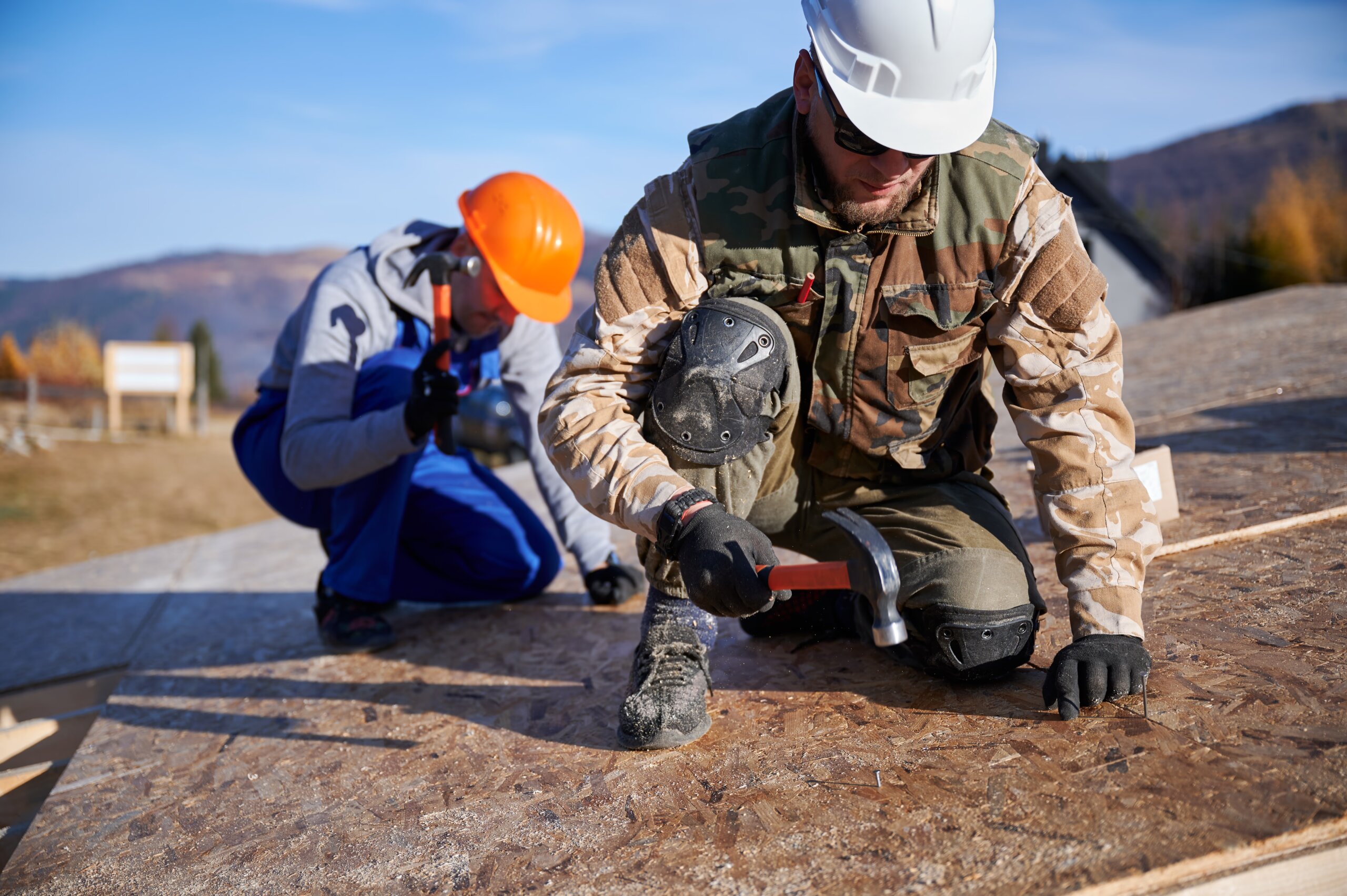 carpenter-hammering-nail-into-osb-panel-while-buil-2025-01-16-22-57-28-utc